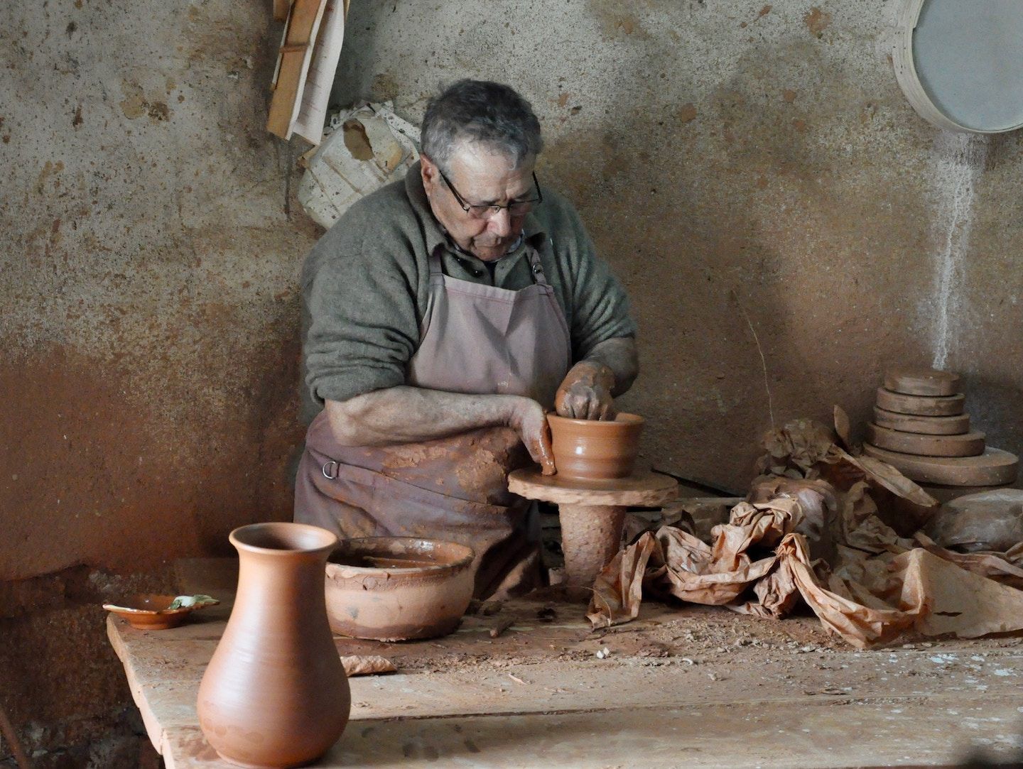 man throwing pottery in portugal 