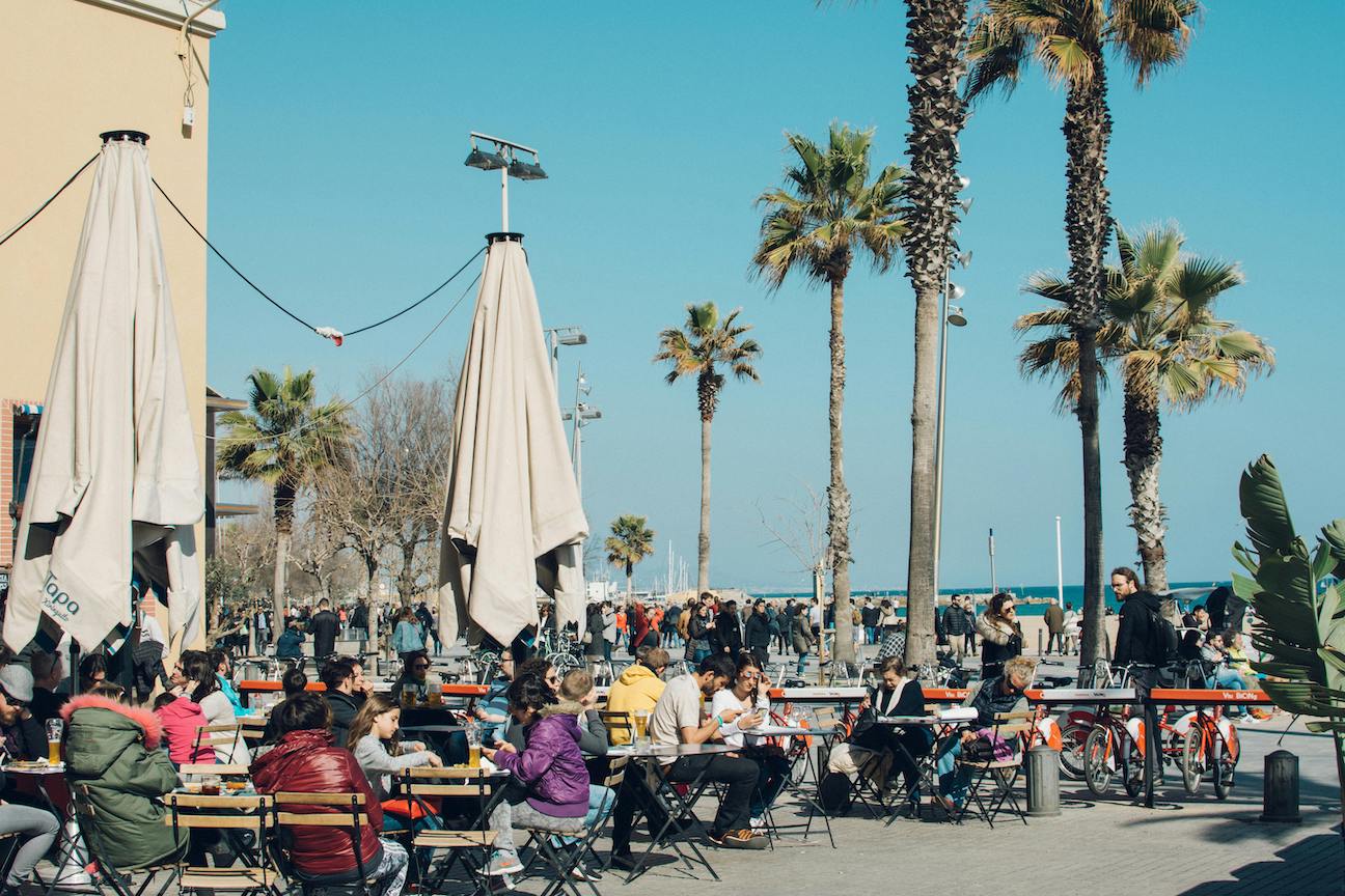 People at restaurant outside near the beach