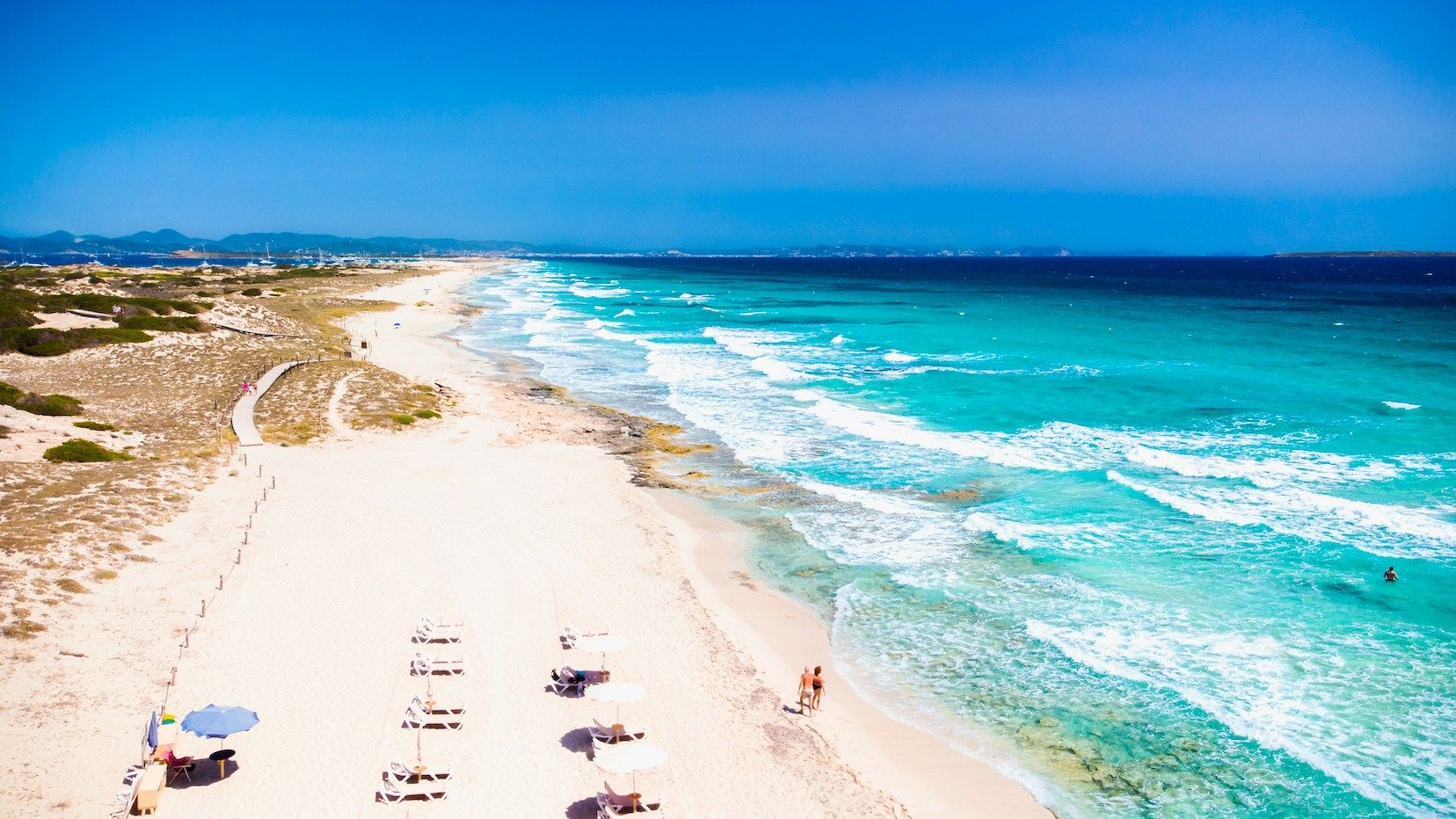 Remote beach in Formentera with shite sands and turquoise waters