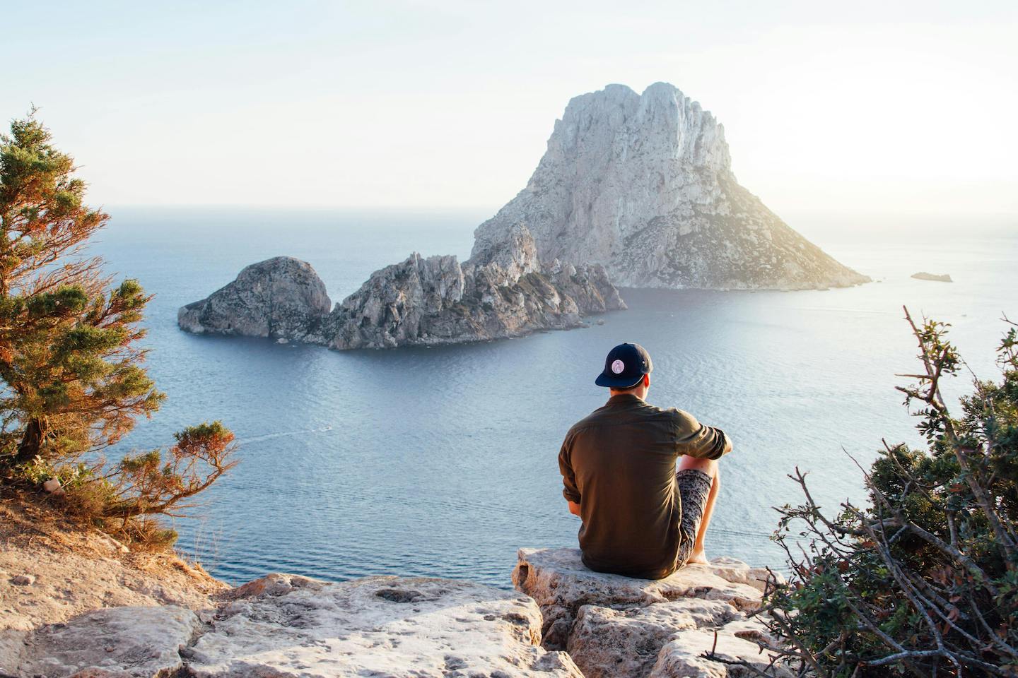 man gazing over water in Ibiza