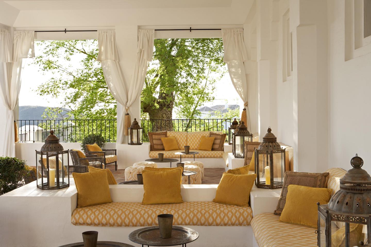 Mustard-yellow designed Indian lounge at hotel in Marbella, Finca Cortesin