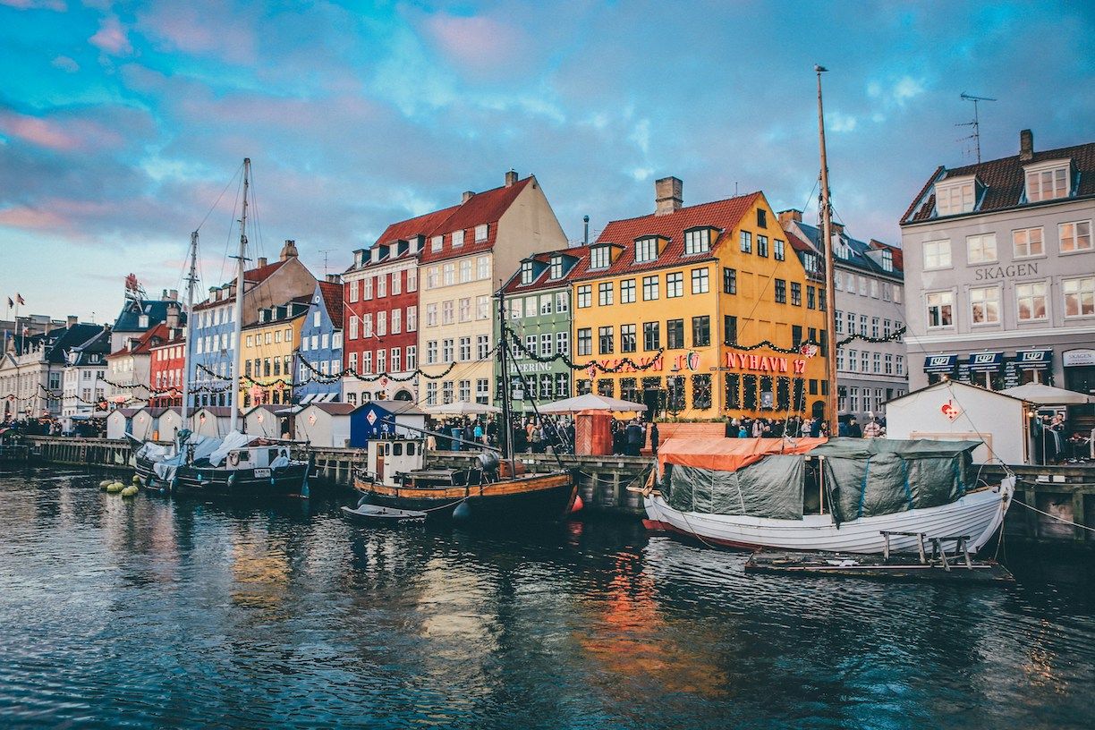 Discover Europe by river in Denmark at Christmas time with colorful buildings