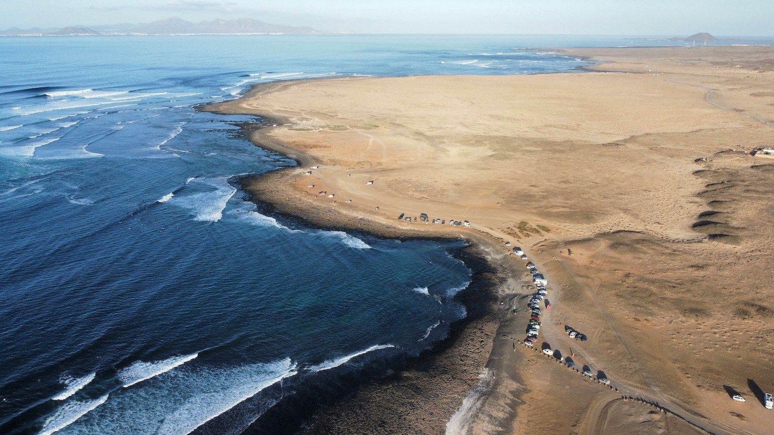 aerial view of desert meeting beach 